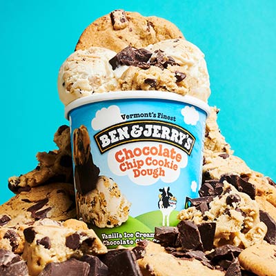 Pint of Ben & Jerry's Chocolate Chip Cookie Dough ice cream surrounded by bits of cookie dough